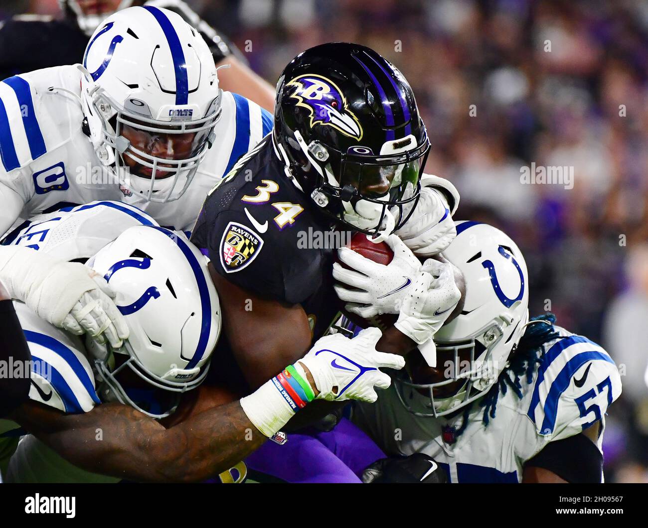 Baltimore, United States. 11th Oct, 2021. Baltimore Ravens running back Ty'Son Williams (34) is stopped by the Indianapolis Colts defense during the first half at M&T Bank Stadium in Baltimore, Maryland, on Monday, October 11, 2021. Photo by David Tulis/UPI Credit: UPI/Alamy Live News Stock Photo