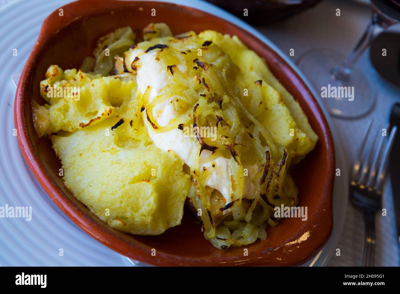 Cod steak baked with potato Stock Photo - Alamy