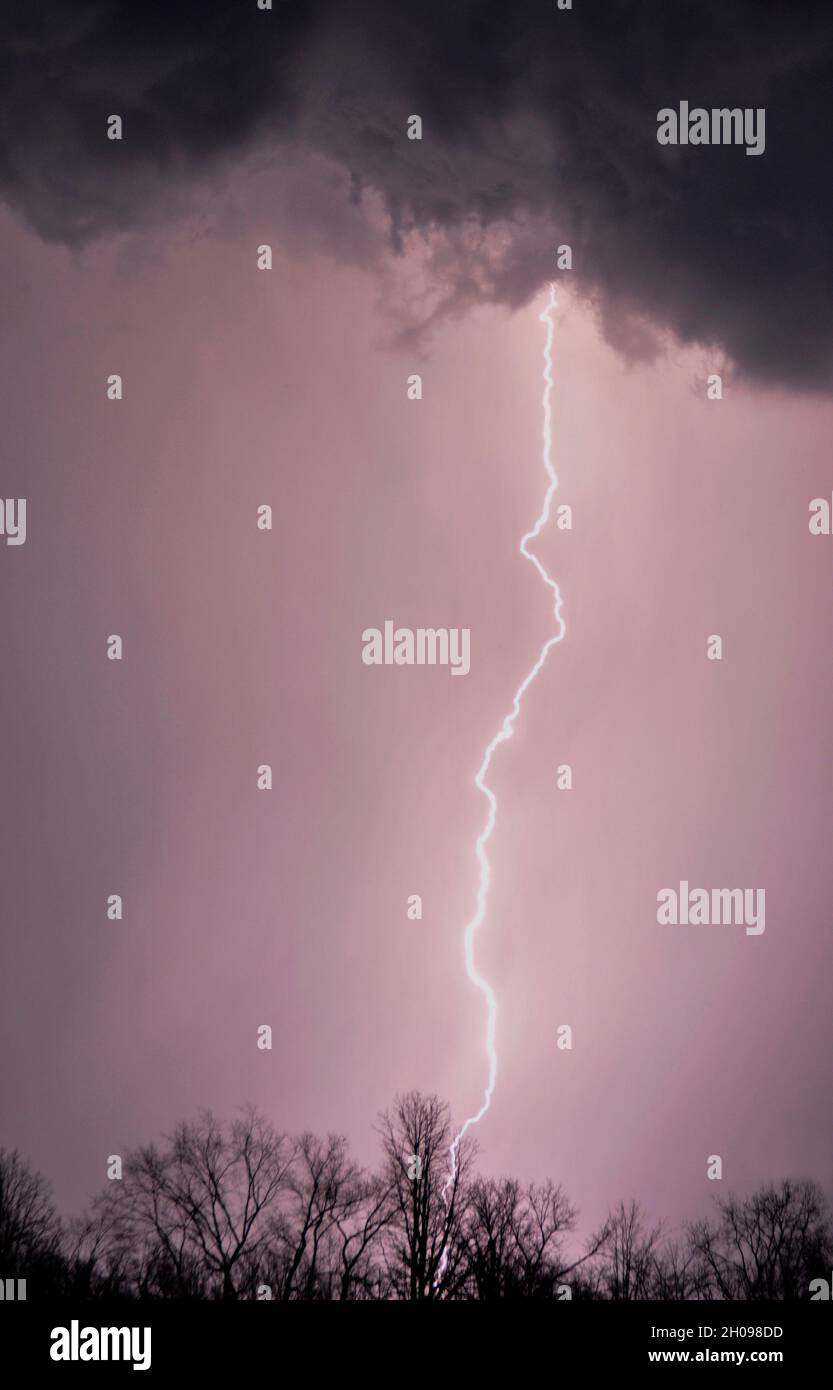 purple sky with single lightning bolt Stock Photo