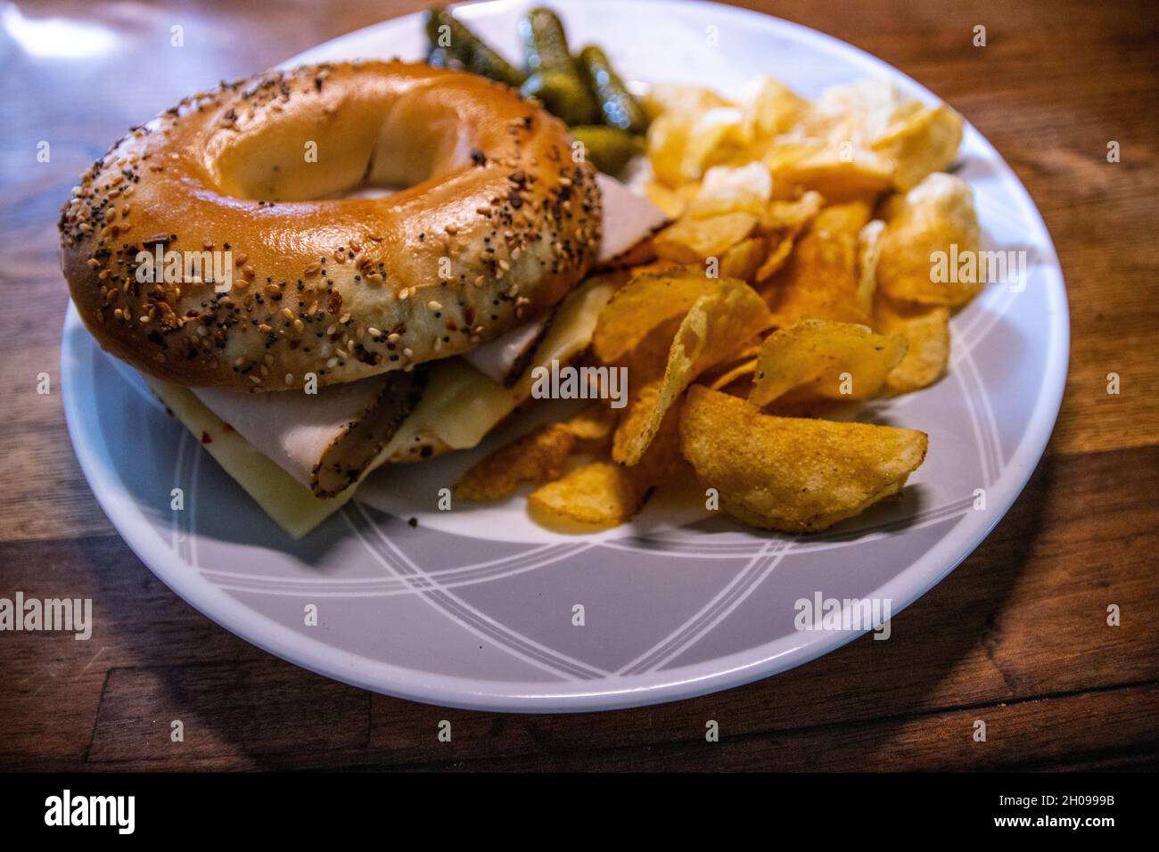 Onion bagel with sliced turkey, cheese, with a side of Jalapeno potato