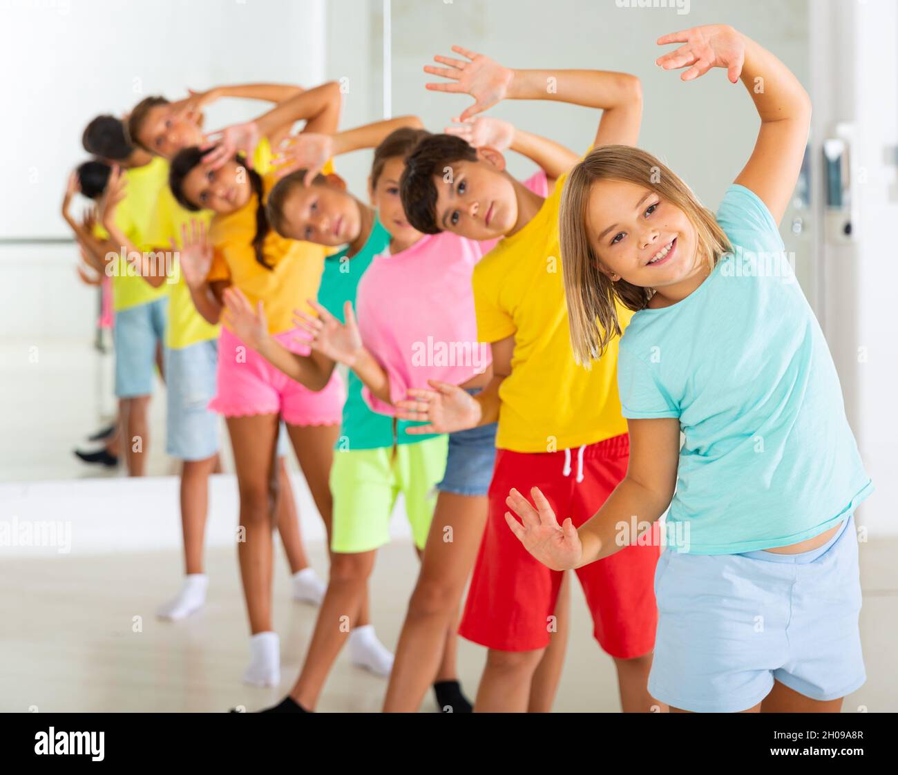 Boys and girls standing in row in dance room Stock Photo - Alamy