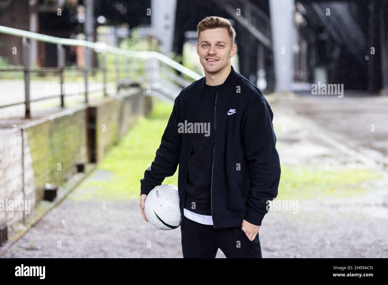 Duisburg, Germany. 06th Oct, 2021. Pascal Gurk stands in front of an old  industrial backdrop. Spectacular football tricks on Tiktok, everyday family  life on YouTube or stories from the side job on