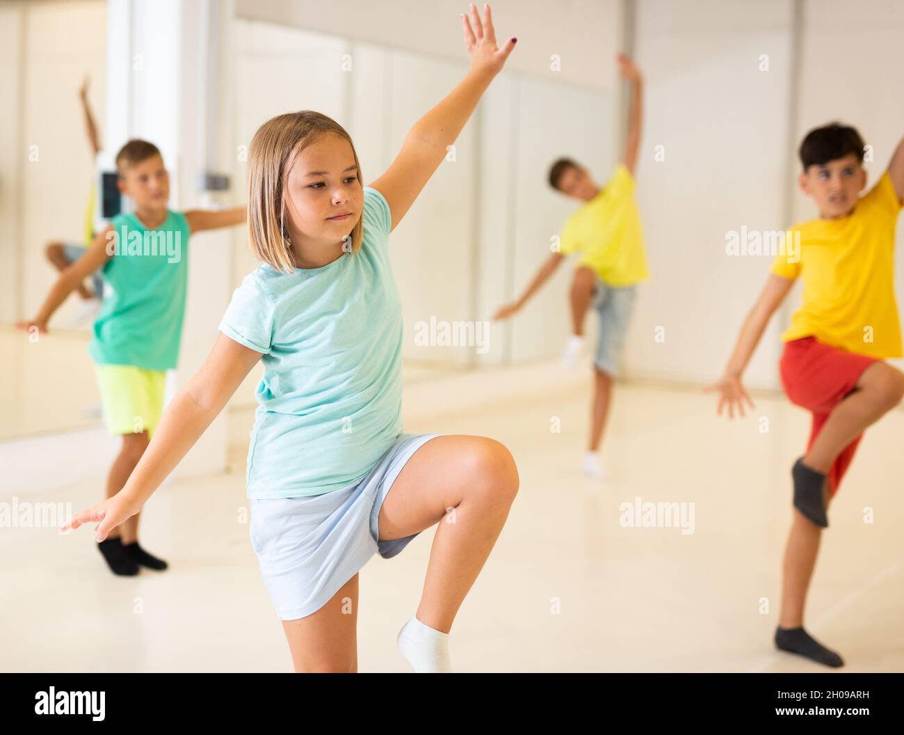 Young girls and boys performing dance in studio Stock Photo