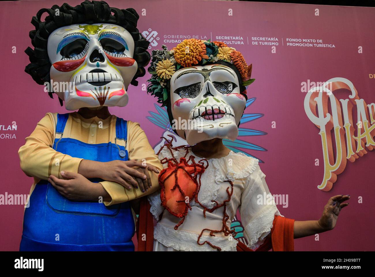 Non Exclusive: Volunteers pose during the official presentation of the International Day of the Dead Parade ' Dia de Muertos' at the Museum of Mexico Stock Photo