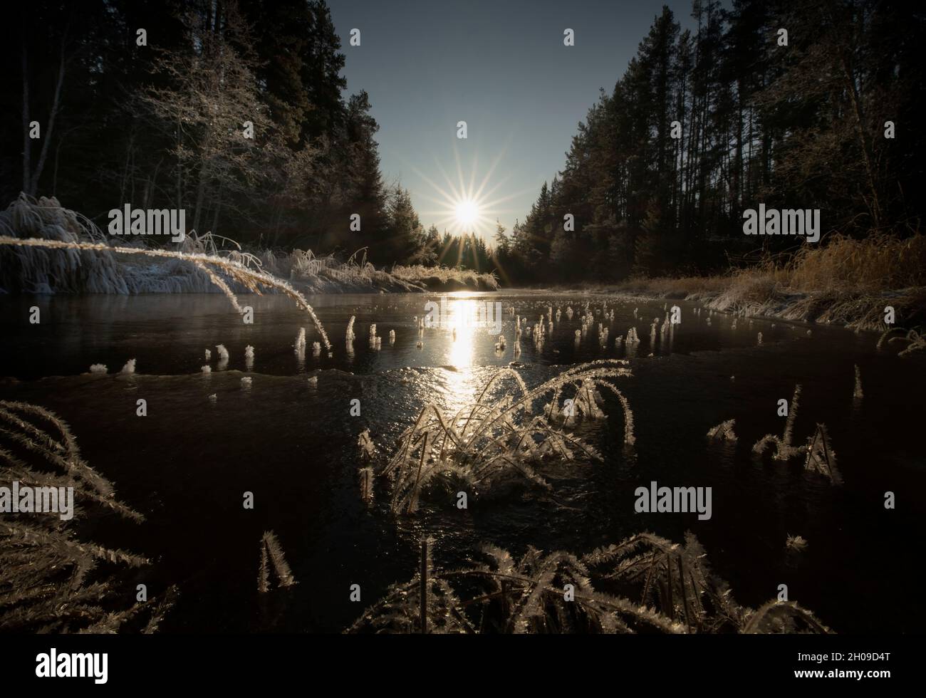 river and ice with sun beams in a winter landscape Stock Photo