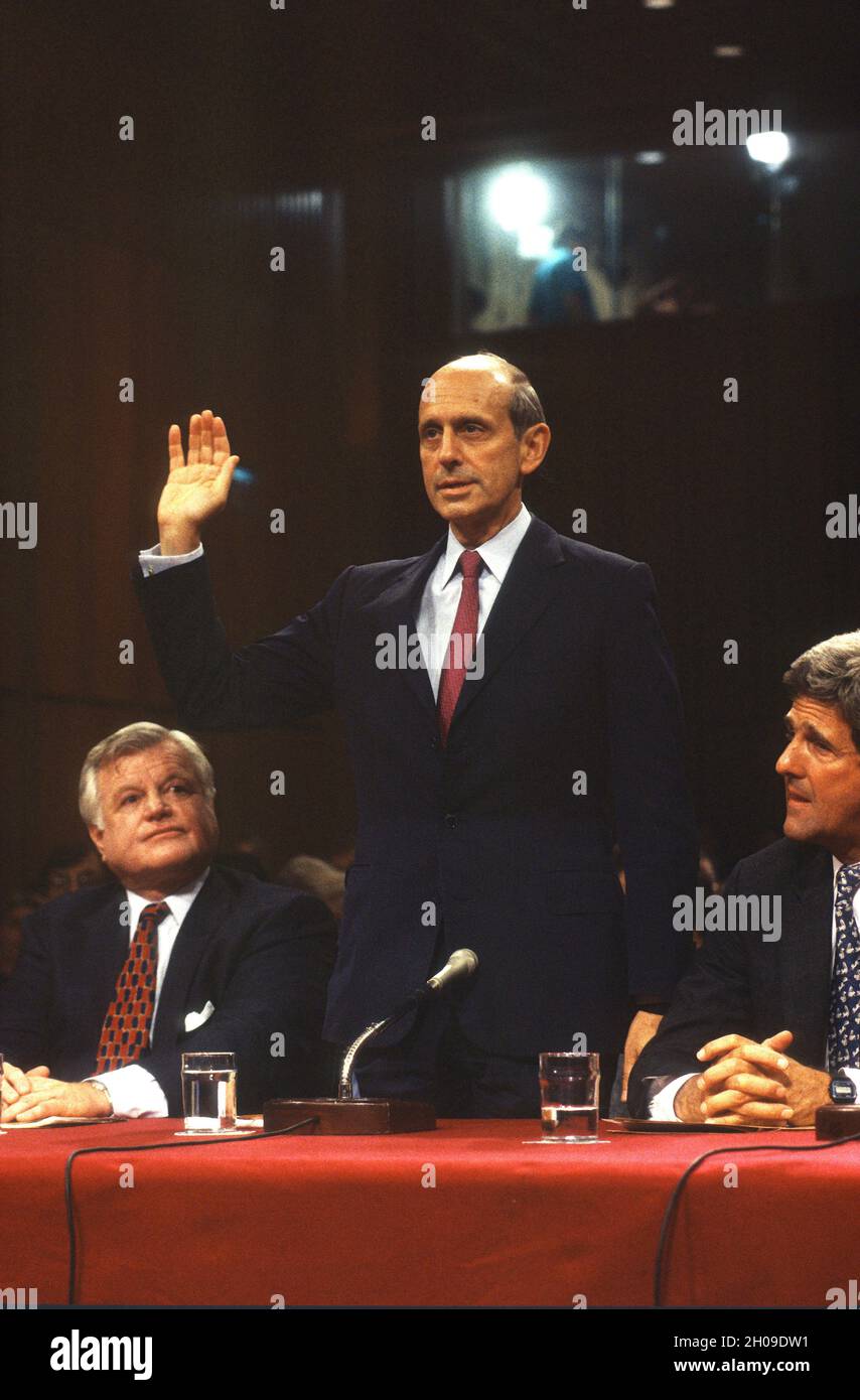 Chief Judge of the US Court of Appeals for the First Circuit, Stephen G. Breyer, US President Bill Clinton’s nominee to replace the retiring Justice Harry Blackmun as Associate Justice of the US Supreme Court, is sworn-in to give testimony during his confirmation hearing on Capitol Hill in Washington, DC on July 12, 1994.  Looking on are United States Senator Ted Kennedy (Democrat of Massachusetts) and United States Senator John Kerry (Democrat of Massachusetts), right,Credit: Ron Sachs / CNP /MediaPunch Stock Photo