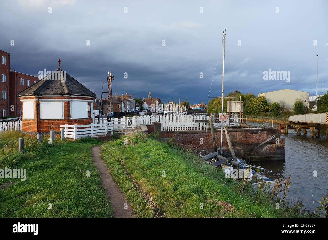The Haven (Witham) riverbank on the High Street featuring the old Octagonal signal box on the dockside railway line Stock Photo
