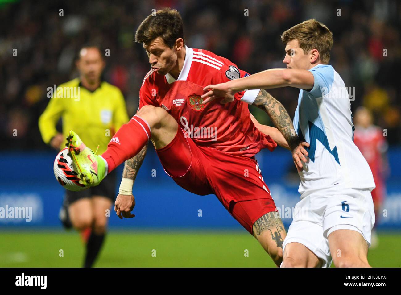 Maribor, Slovenia. 11th Oct, 2021. Fedor Smolov (center) of Russia and Jaka Bijol (right) of Slovenia are seen in action during the 2022 FIFA World Cup Group H Qualifier match between Slovenia and Russia.(Final score; Slovenia 1:2 Russia) (Photo by Milos Vujinovic/SOPA Images/Sipa USA) Credit: Sipa USA/Alamy Live News Stock Photo