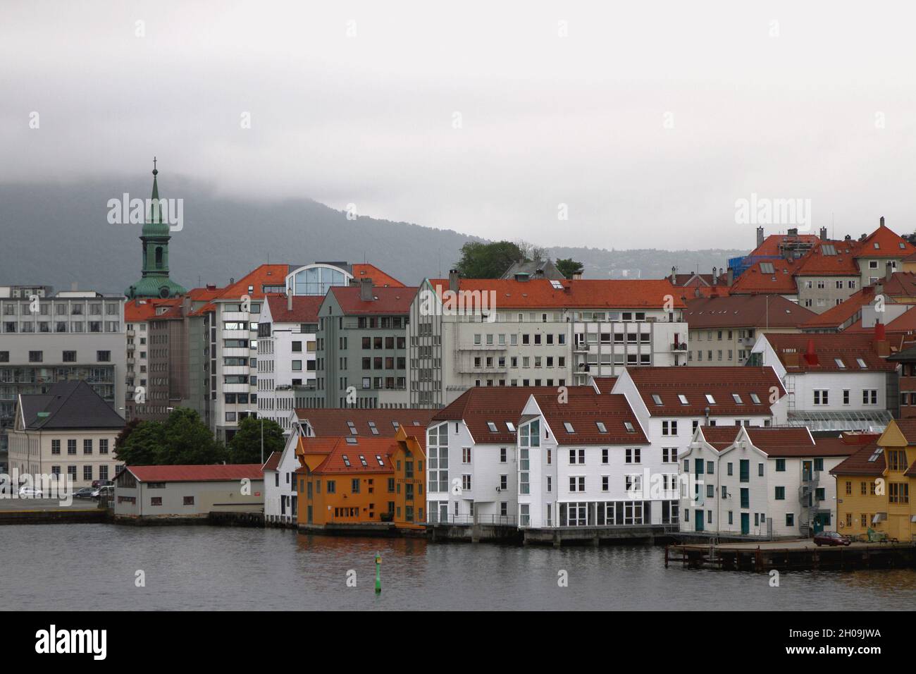 Bergen, Norway - Jun 13, 2021: City on shore of bay Stock Photo