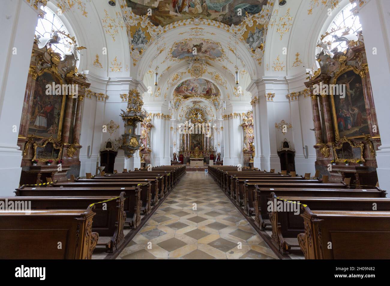 Schäftlarn, Germany - Nov 17, 2020: View along the main aisle of the church of Schäftlarn Abbey towards the altar. Interior of a typical upper bavaria Stock Photo