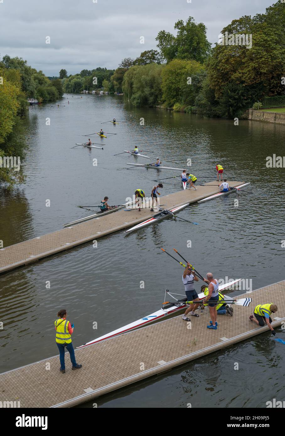 Single scull rowers on the River Thames as seen from Wallingford bridge