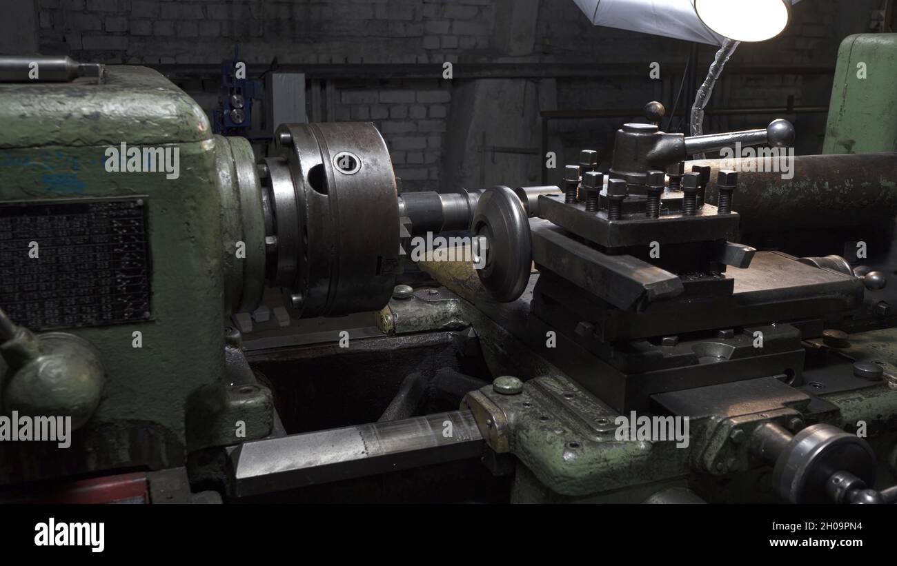 Working process with metal details on lathe in workplace Stock Photo