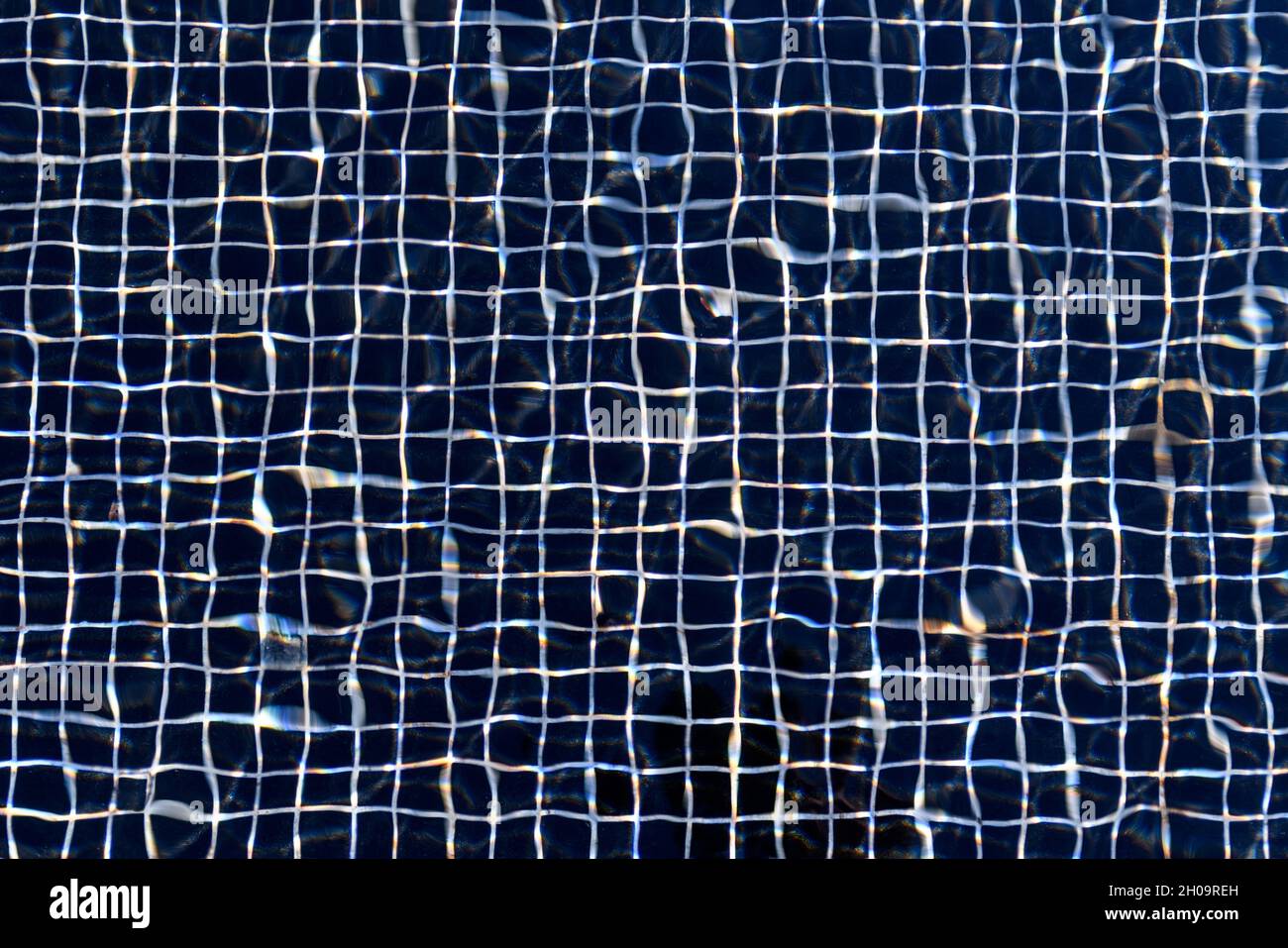 Abstract background from distortion of water wave in swimming pool ...