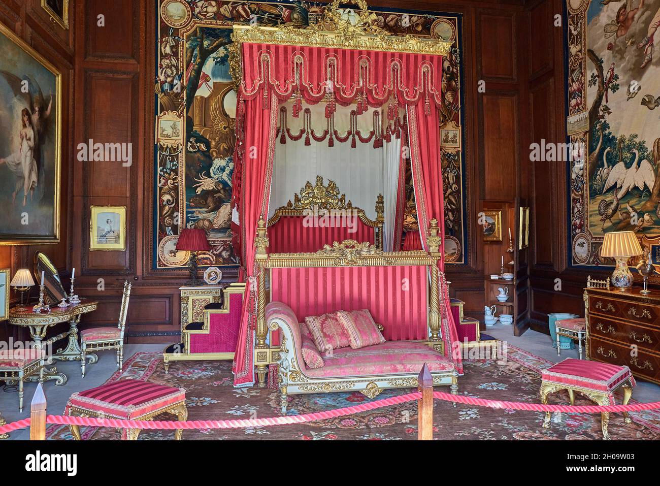 Eighteenth century curtained bed (used by queen Victoria and prince Albert) in the Second George room at Burghley House, Stamford, England. Stock Photo