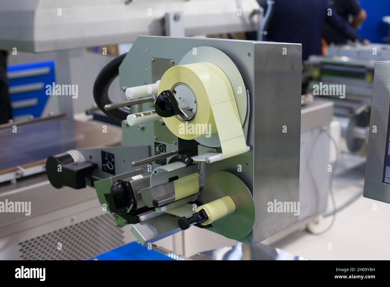 Close up of labeling machine in food industry Stock Photo