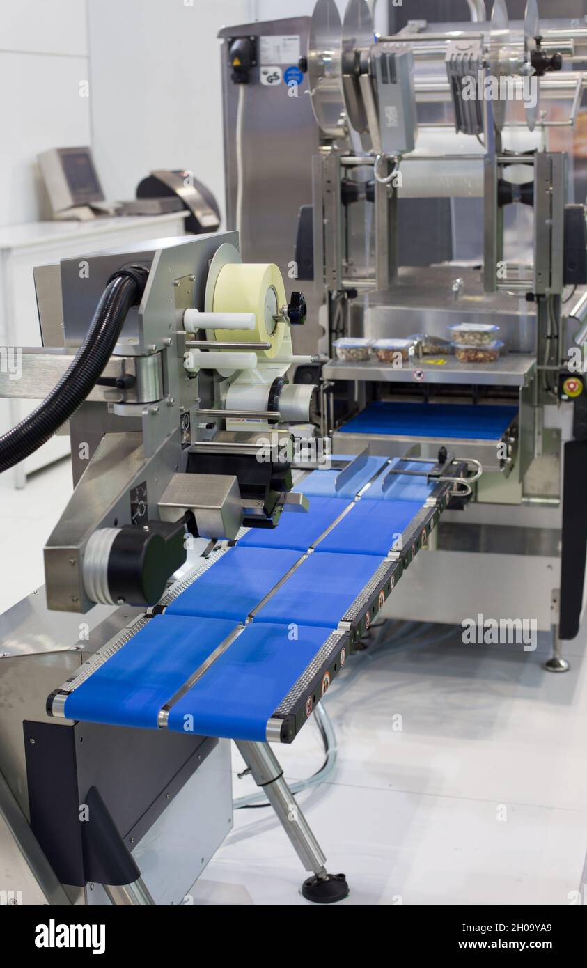 Close up of labeling machine in food industry Stock Photo