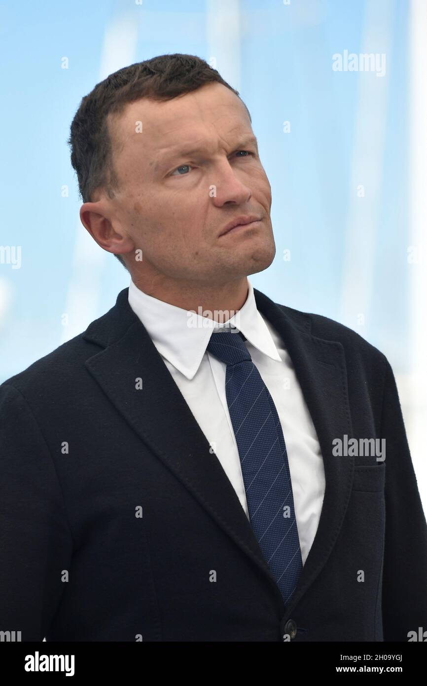 74th edition of the Cannes Film Festival: writer Sylvain Tesson posing during a photocall for the film “The Velvet Queen” (French: “La panthere des ne Stock Photo