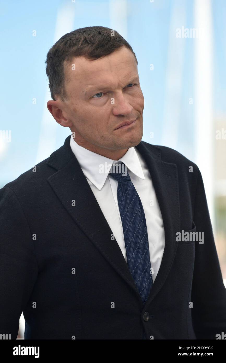 74th edition of the Cannes Film Festival: writer Sylvain Tesson posing during a photocall for the film “The Velvet Queen” (French: “La panthere des ne Stock Photo