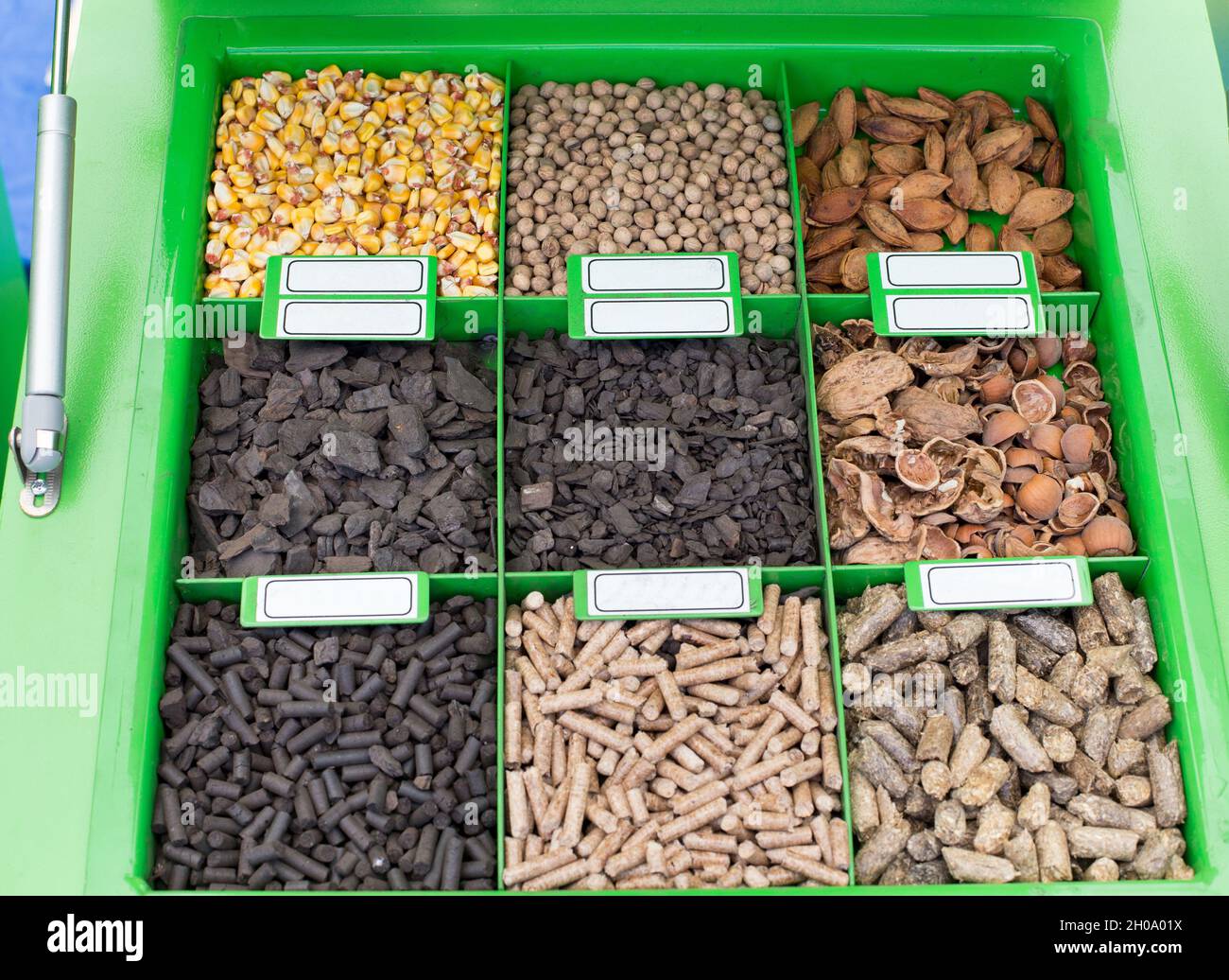 Pellet Stove With Different Heating Materials As Samples Stock Photo