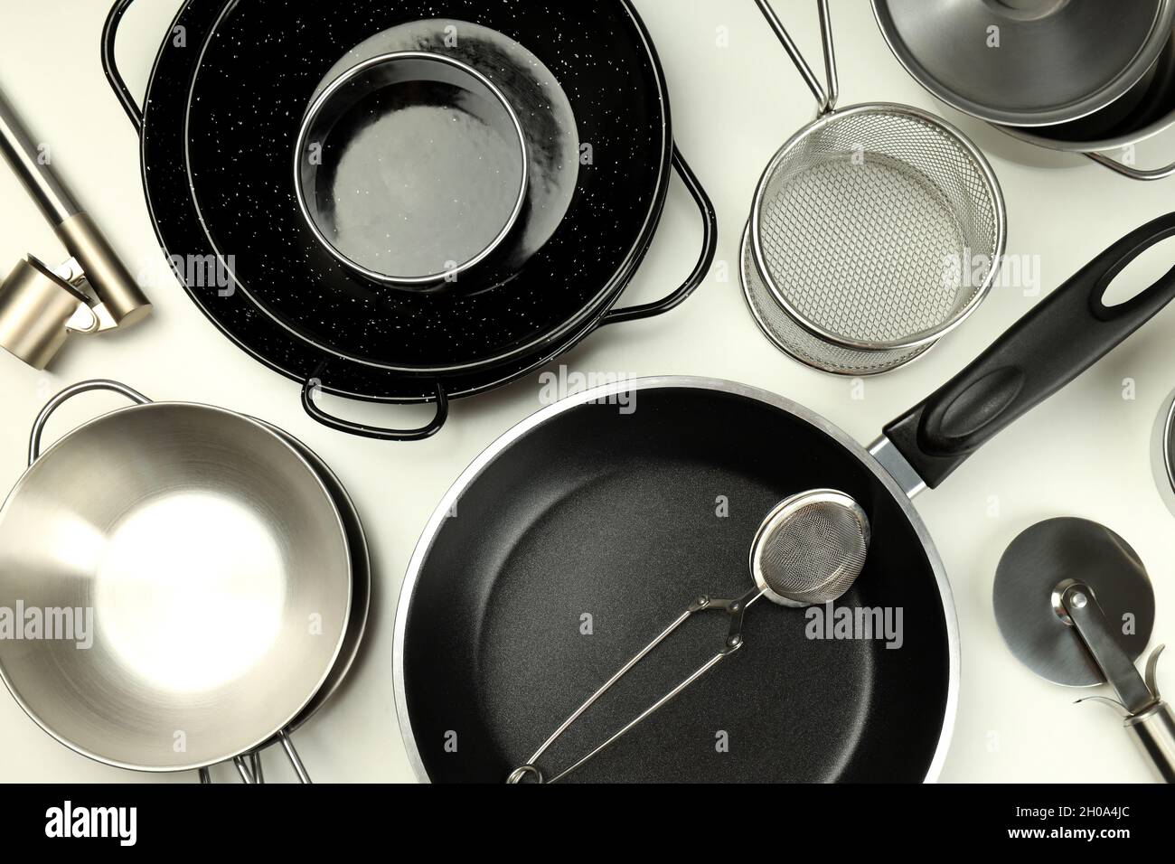 Set of different kitchen utensil on white background Stock Photo - Alamy