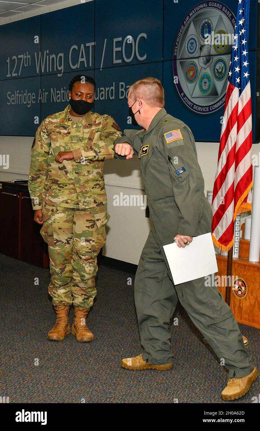 127th Wing Commander Brigadier General Mammen promotes Airman Sydney Dhue from 127th Wing Command Post to Airman First Class (A1C). Stock Photo