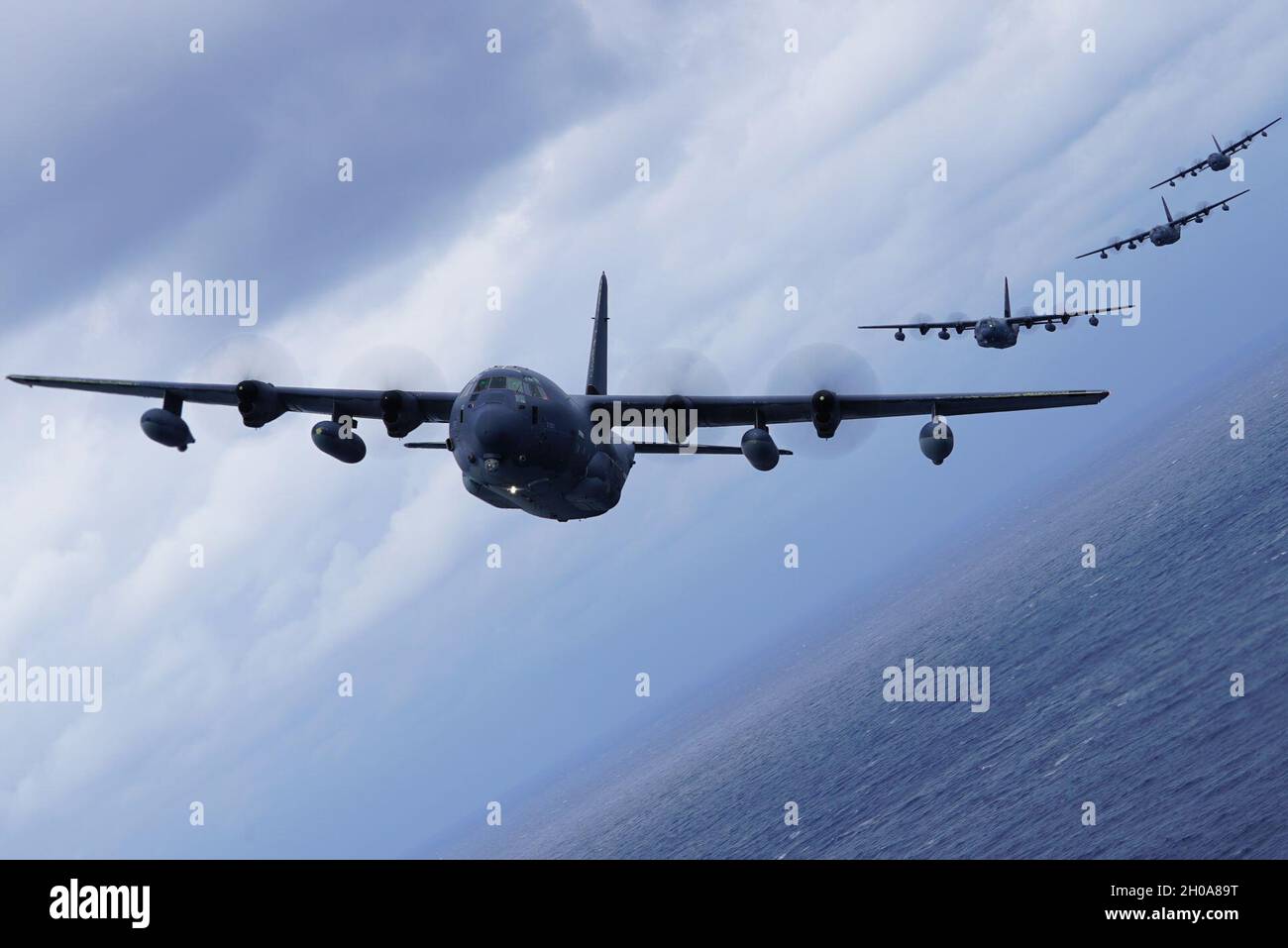 A formation of MC-130J Commando IIs flies off the coast of Okinawa ...
