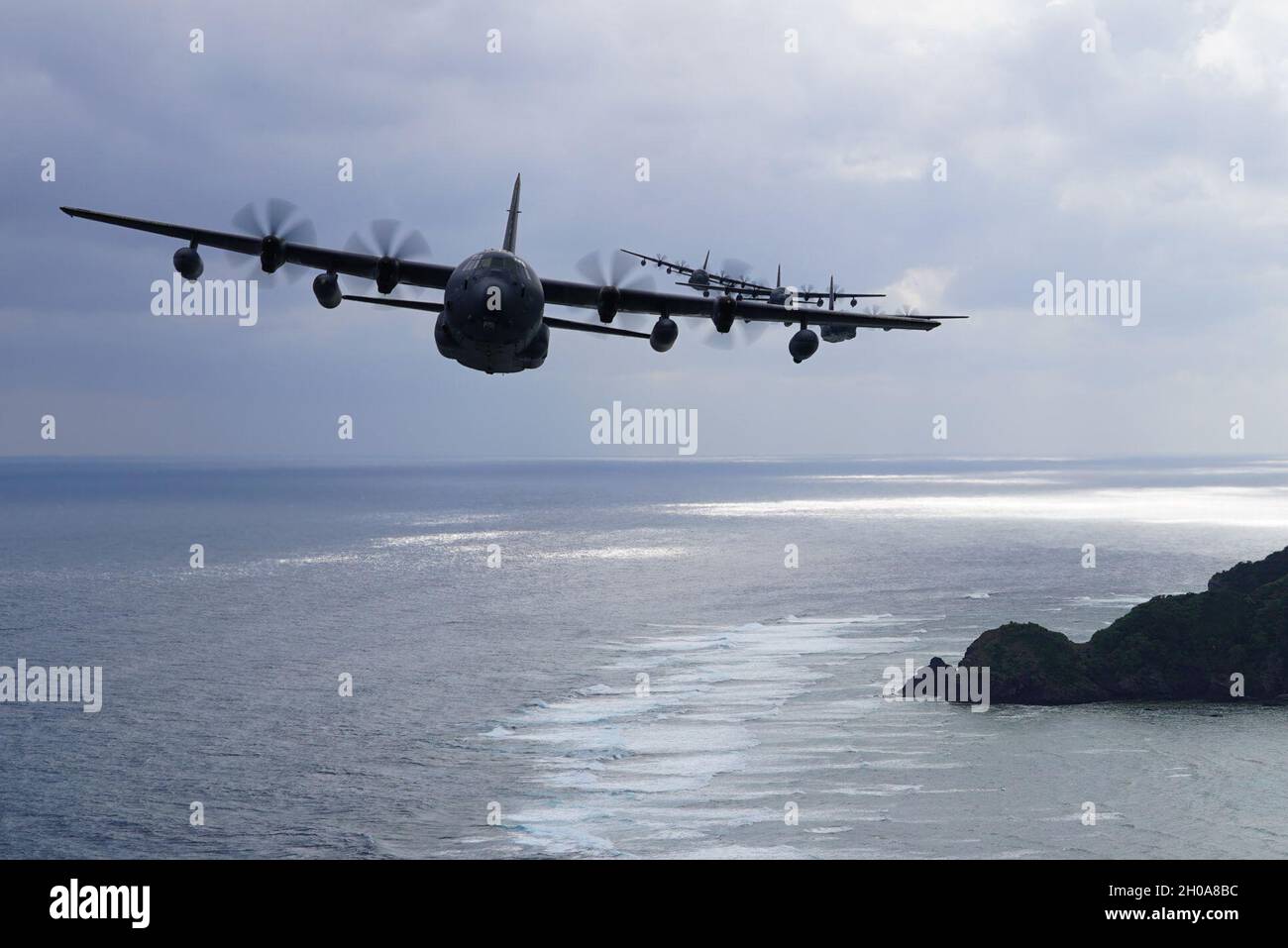 A formation of MC-130J Commando IIs flies off the coast of Okinawa ...