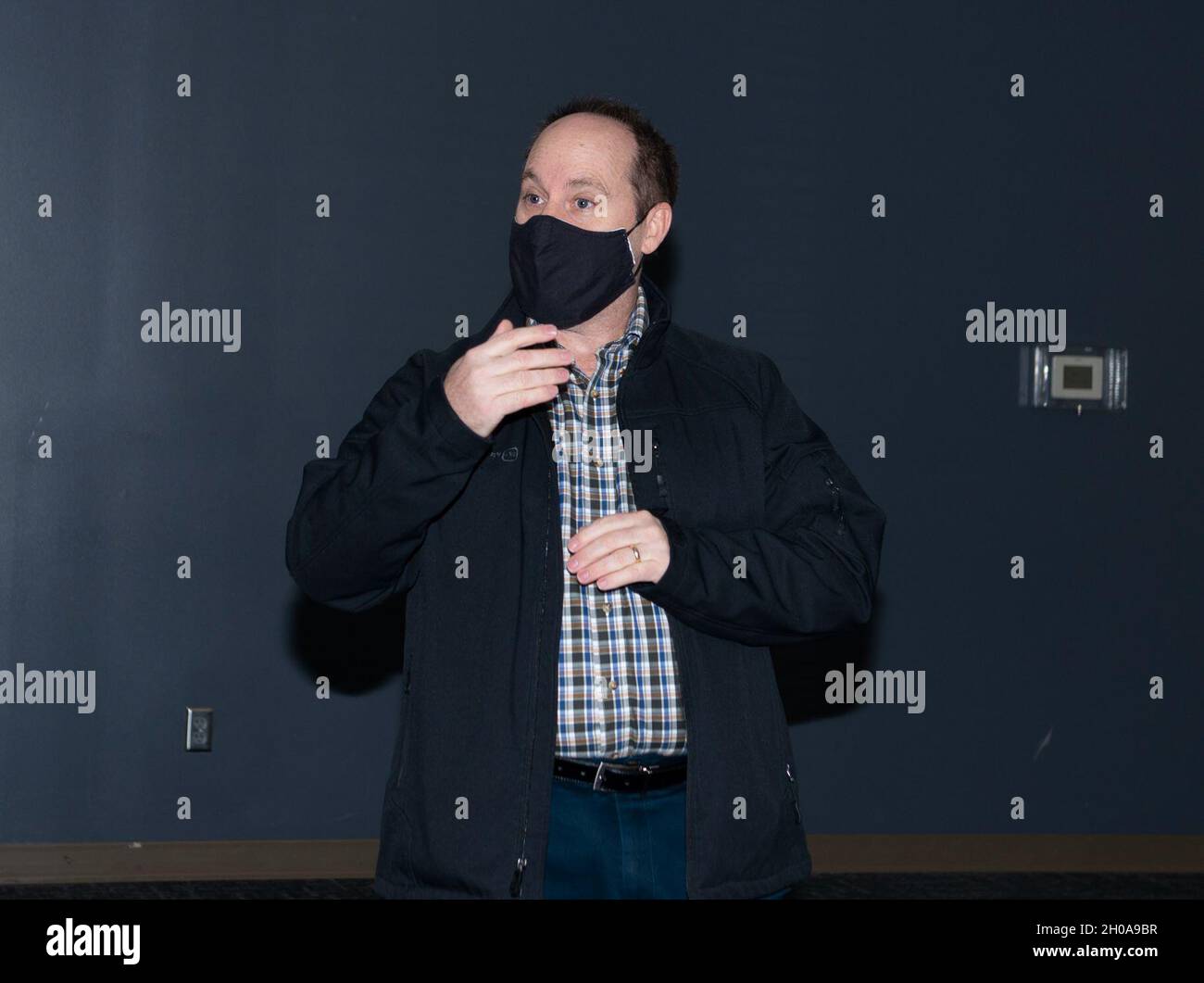 Joseph Becker, Privatized Housing resident advocate, speaks during a council meeting at The