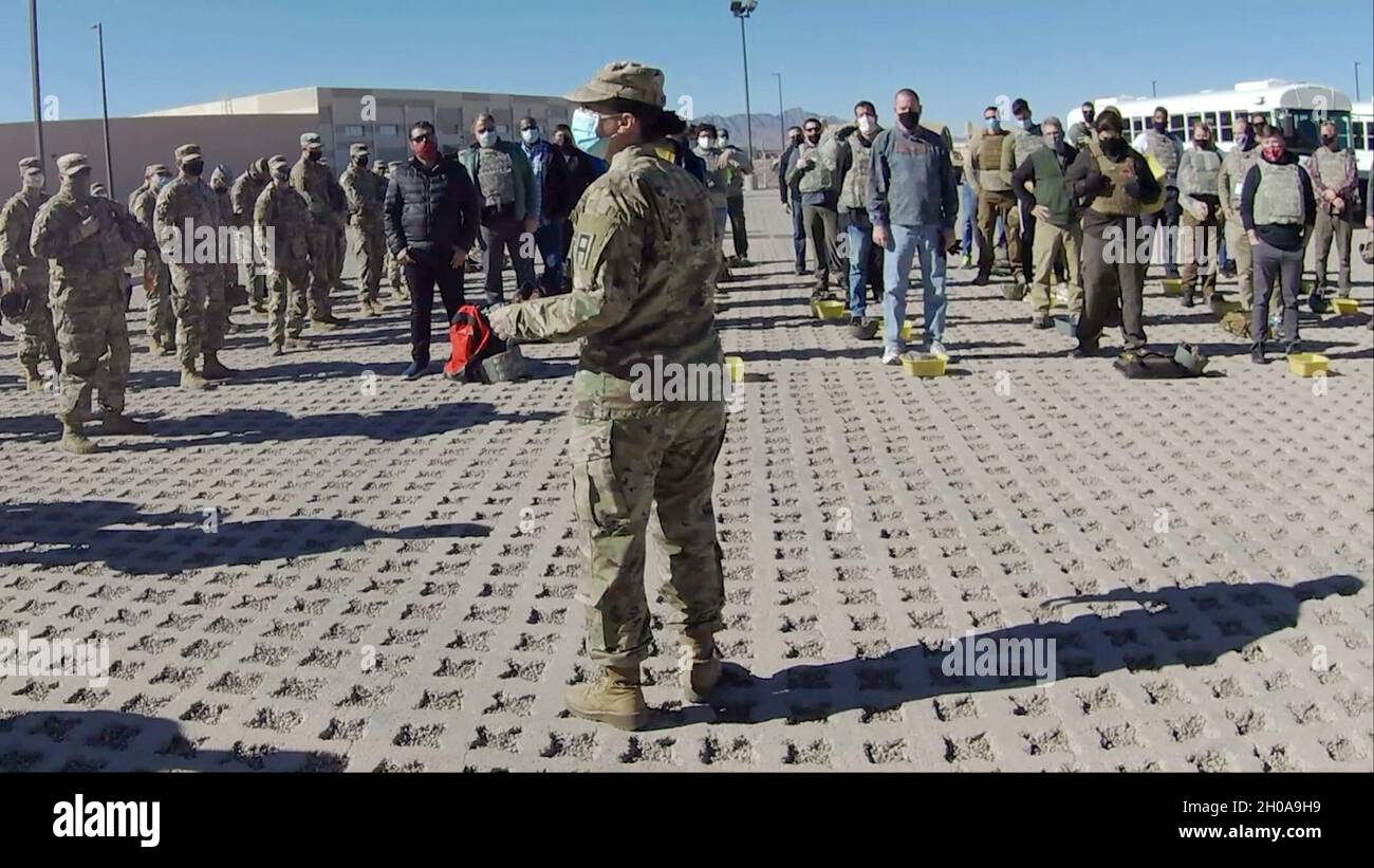 U.S. Army Sgt. 1st Class Chantall V. Macias, senior trainer, 3-347th Training Support Battalion, 5th Armored Brigade, gives a safety briefing to service members and government contractors as they prepare to enter a vehicle rollover training simulator Jan. 6, 2021, in Ft. Bliss, Texas. From August 2020 to July 2021, Macias and her team executed 84 training events that emulate what personnel may encounter while supporting various contingency operations across the globe. They prioritized 23 mission essential tasks across 21 two-week training cycles. In addition to egress rollover simulations, the Stock Photo