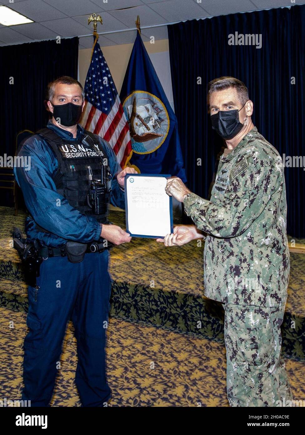 Naval Support Activity Panama City Commanding Officer Cmdr. Kevin Christenson presented Ofc. Matthew Moskowitz, Security Department, with a letter of appreciation, Dec. 7. In September, Moskowitz found an undeclared weapon and narcotics while conducting a vehicle inspection during a delivery to shipping and receiving. Moskowitz's quick action prevented the introduction of illegal and illicit contraband and the unlawful entry into a federal installation with a firearm. Stock Photo