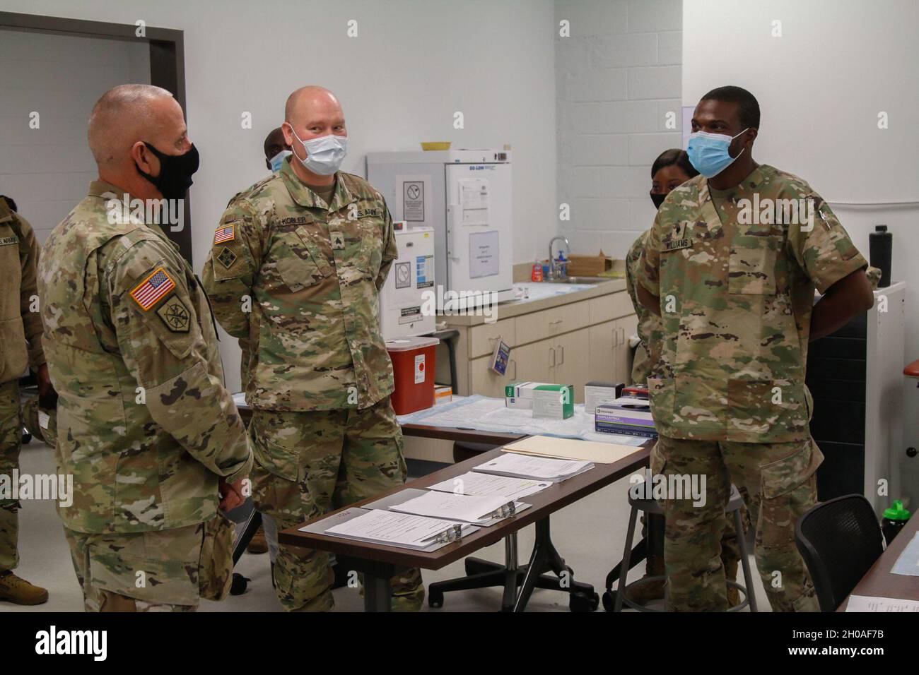 U.S. Army Soldier, Command Sgt. Maj. Jeff Logan, the State Sergeant major, Georgia National Guard addresses the medical Soldiers administrating the COVID-19 vaccine at Clay National Guard Center in Marietta, Georgia Jan. 9, 2021. Guardsmen and civilians on base volunteered to receive the vaccine in the effort to combat COVID-19. Stock Photo