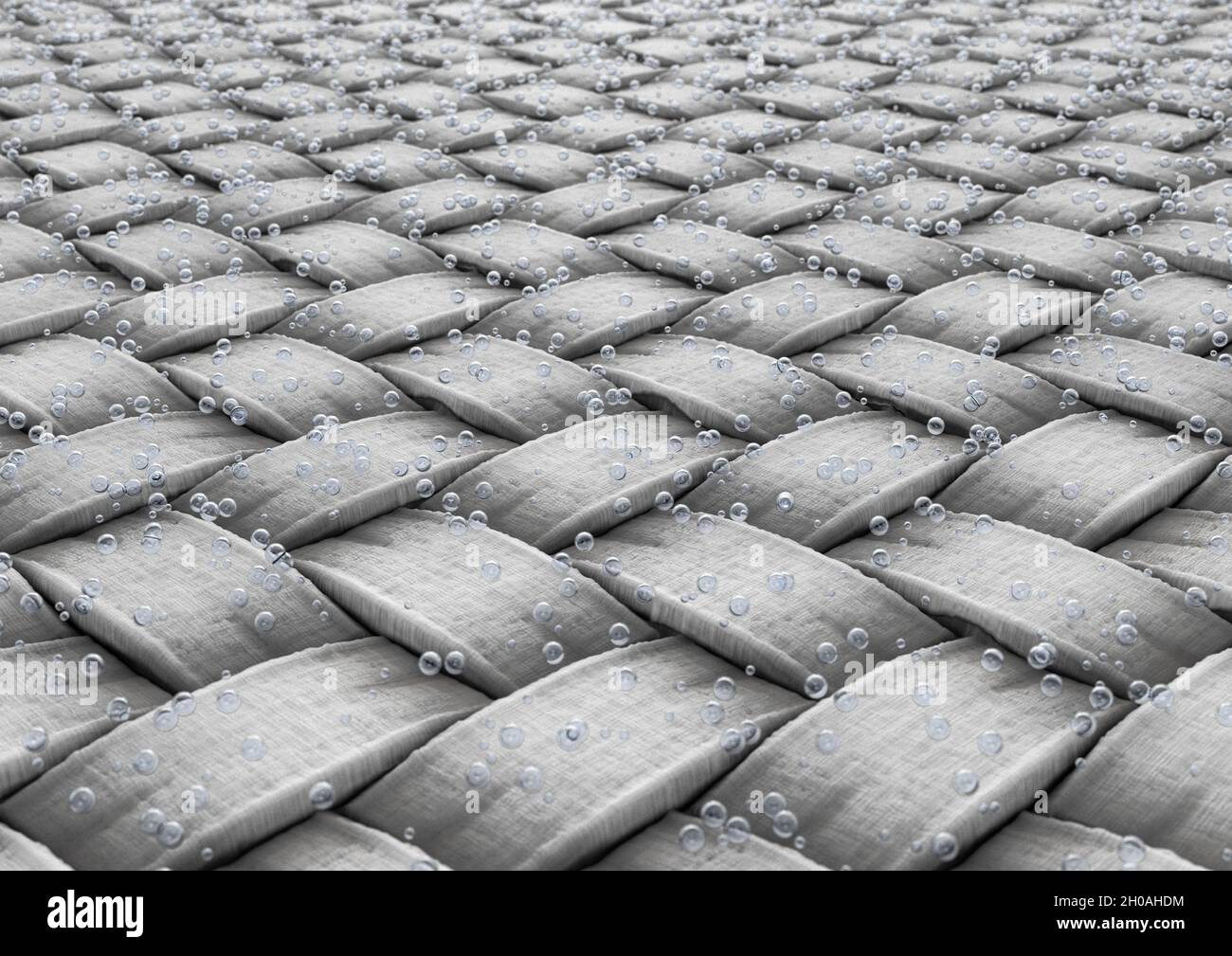 A microscopic view of a simple woven textile fabric and water bubbles