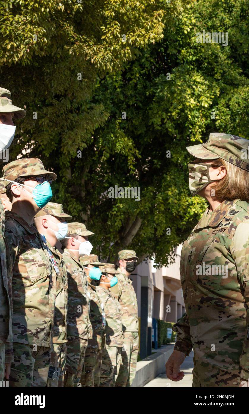 Lt. Gen. Laura J. Richardson, commanding general of U.S. Army North (Fifth Army) and the Joint Forces Land Component Command, is greeted by service members during her visit to Adventist Health White Memorial Hospital, Los Angeles, Calif., Jan. 11, 2021. U.S. Northern Command, through U.S. Army North, remains committed to providing flexible Department of Defense support to the whole-of-America COVID-19 response. Stock Photo