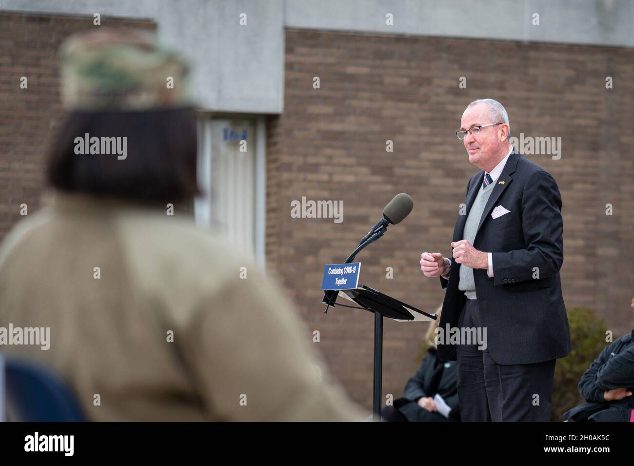 New Jersey Gov. Phil Murphy addresses the press at Rowan College of South Jersey in Sewell, N.J., Jan. 11, 2020. Soldiers are assisting in temperature checks, registration, guiding individuals through the building, and monitoring people after they received their vaccinations. Stock Photo