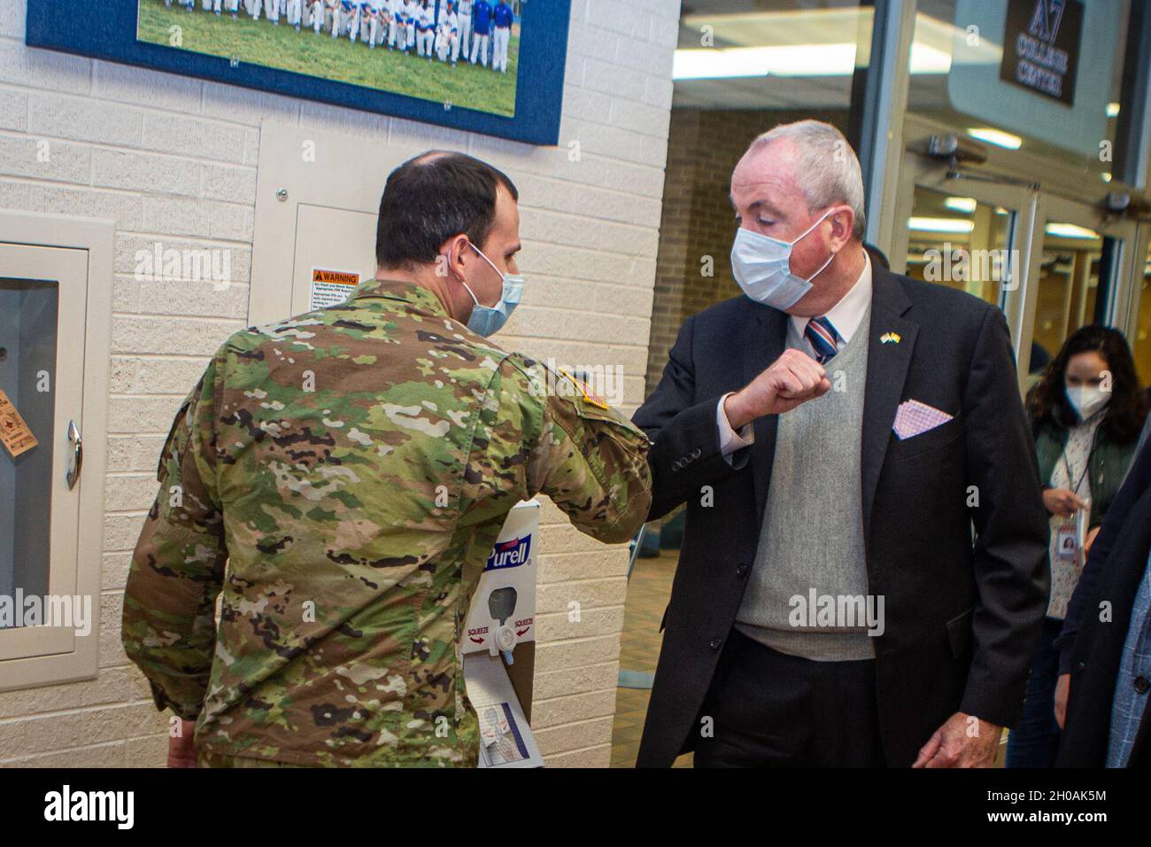 New Jersey Gov. Phil Murphy greets Soldiers at Rowan College of South Jersey in Sewell, N.J., Jan. 11, 2020. Soldiers are assisting in temperature checks, registration, guiding individuals through the building, and monitoring people after they received their vaccinations. Stock Photo