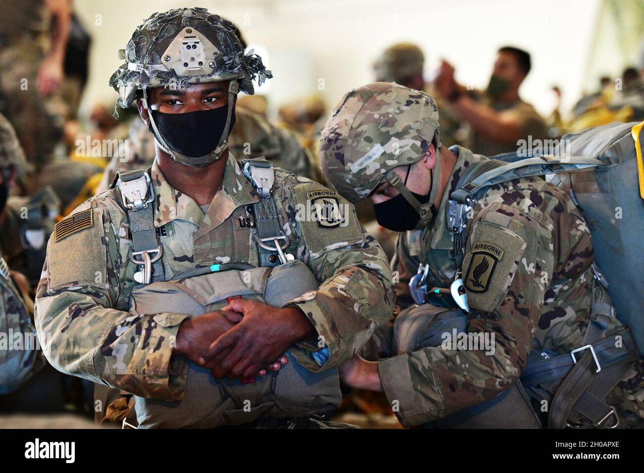 U.S. Army Paratroopers assigned to the 173rd Airborne Brigade, don a ...