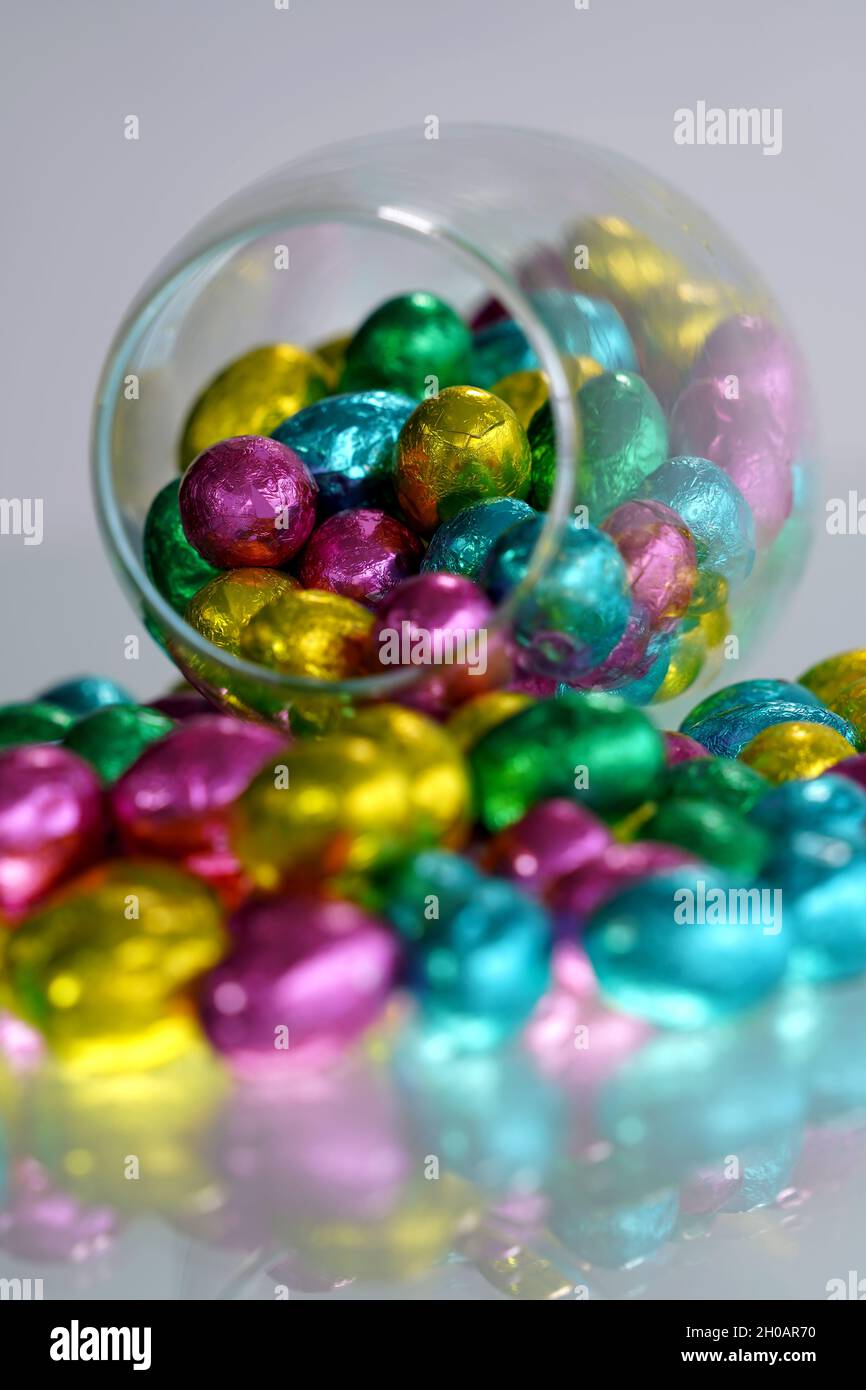 Multi-colored Easter eggs wrapped in foil. Stock Photo