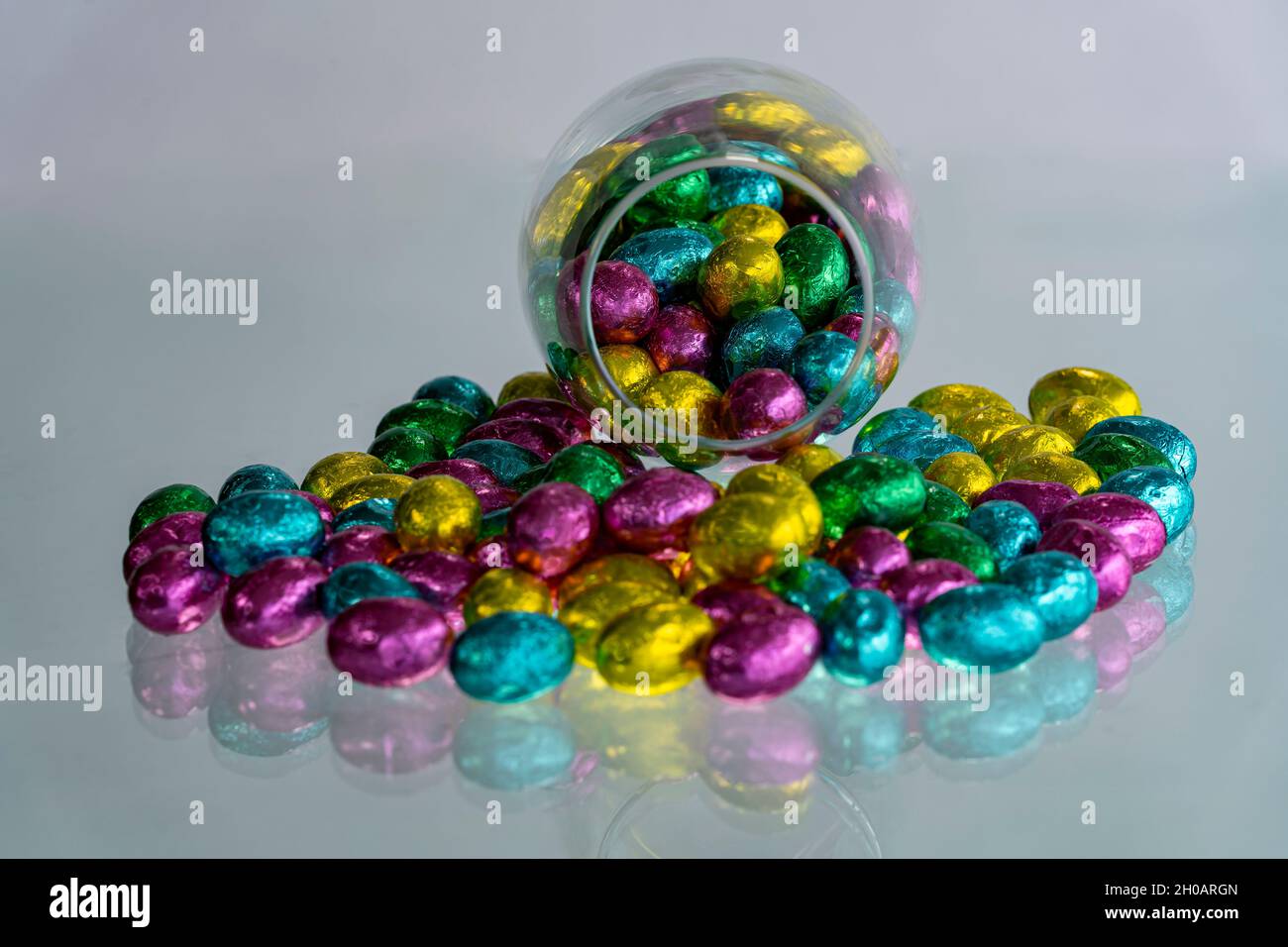 Multi-colored Easter eggs wrapped in foil. Stock Photo
