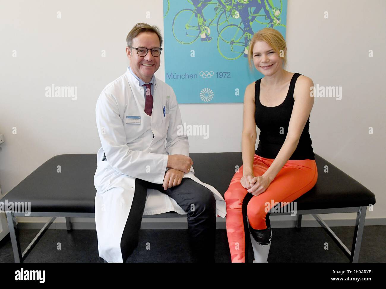 Munich, Germany. 12th Oct, 2021. The medical director of the Institute for Sports Medicine and Sports Cardiology at TU Munich, Martin Halle, and actress Silke Popp show off at the Center for Prevention and Sports Medicine at TU Munich. The Center for Prevention and Sports Medicine at TU Munich is the largest outpatient clinic for prevention and sports medicine. Credit: Felix Hörhager/dpa/Alamy Live News Stock Photo