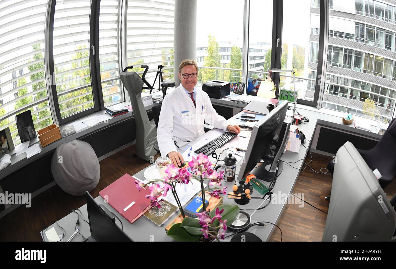Munich, Germany. 12th Oct, 2021. The medical director of the Institute for Sports Medicine and Sports Cardiology at TU Munich, Martin Halle, sits in his office at the Center for Prevention and Sports Medicine at TU Munich. The Center for Prevention and Sports Medicine at TU Munich is the largest outpatient clinic for prevention and sports medicine. Credit: Felix Hörhager/dpa/Alamy Live News Stock Photo