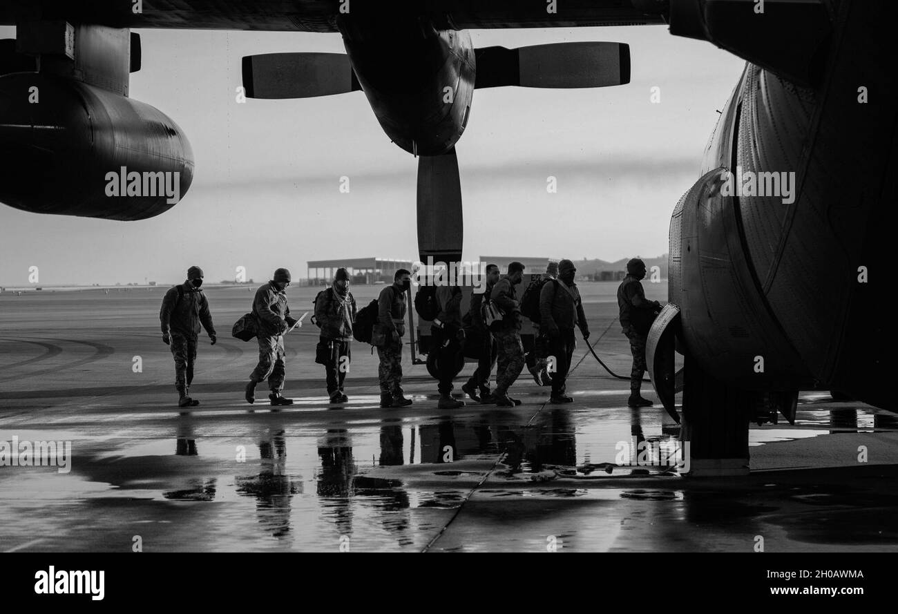 Airmen of the 1st Fighter Wing board a U.S. Air Force C-130 Hercules to depart for an Agile Combat Employment exercise at Joint Base Langley-Eustis, Virginia, Jan. 13, 2021. Members from the 633rd Air Base Wing, 1st FW, 192nd Wing, and Missouri Air National Guard completed a week-long exercise to help shape future ACE procedures. Stock Photo