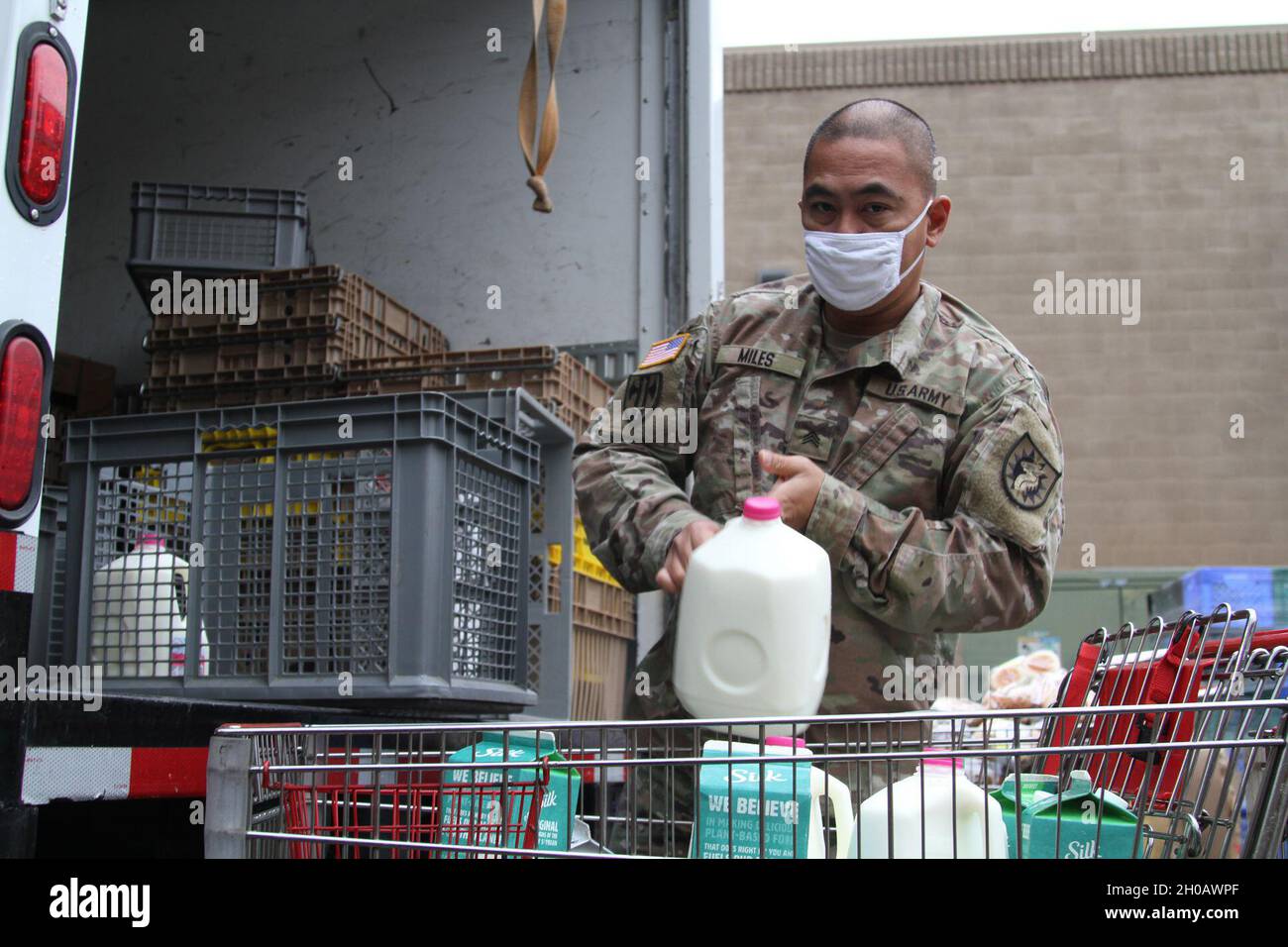 U.S. Army Sgt. Joseph Miles of the California Army National Guard’s 1113th Transportation Company, 749th Combat Sustainment Support Battalion, 224th Sustainment Brigade, sorts perishable and non-perishable food at an Amador County supermarket during an early-January food run for the Interfaith Food Bank in Jackson, California. Cal Guardsmen still operate at food banks throughout the state — just not as much as before — since being state-activated March 2020 for the coronavirus pandemic. Miles makes the run on his own, sometimes picking up more than 2,000 pounds of food on a daily basis. In ear Stock Photo