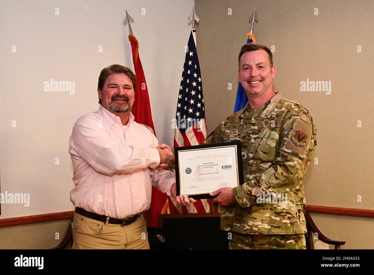 Jon Arnette, Regional Director, Systems of Care, with Novartis Pharmaceuticals Corporation, receives the Employer Support of the Guard and Reserve (ESGR) Patriot Award at the 118th Wing Air National Guard Base in Nashville, Tenn., on Jan. 14, 2021. The patriot award is given to individual supervisors for support provided to citizen/warriors in the form of flexible schedules, time off prior to and after deployment, caring for families, and granting leave of absence if needed. Stock Photo