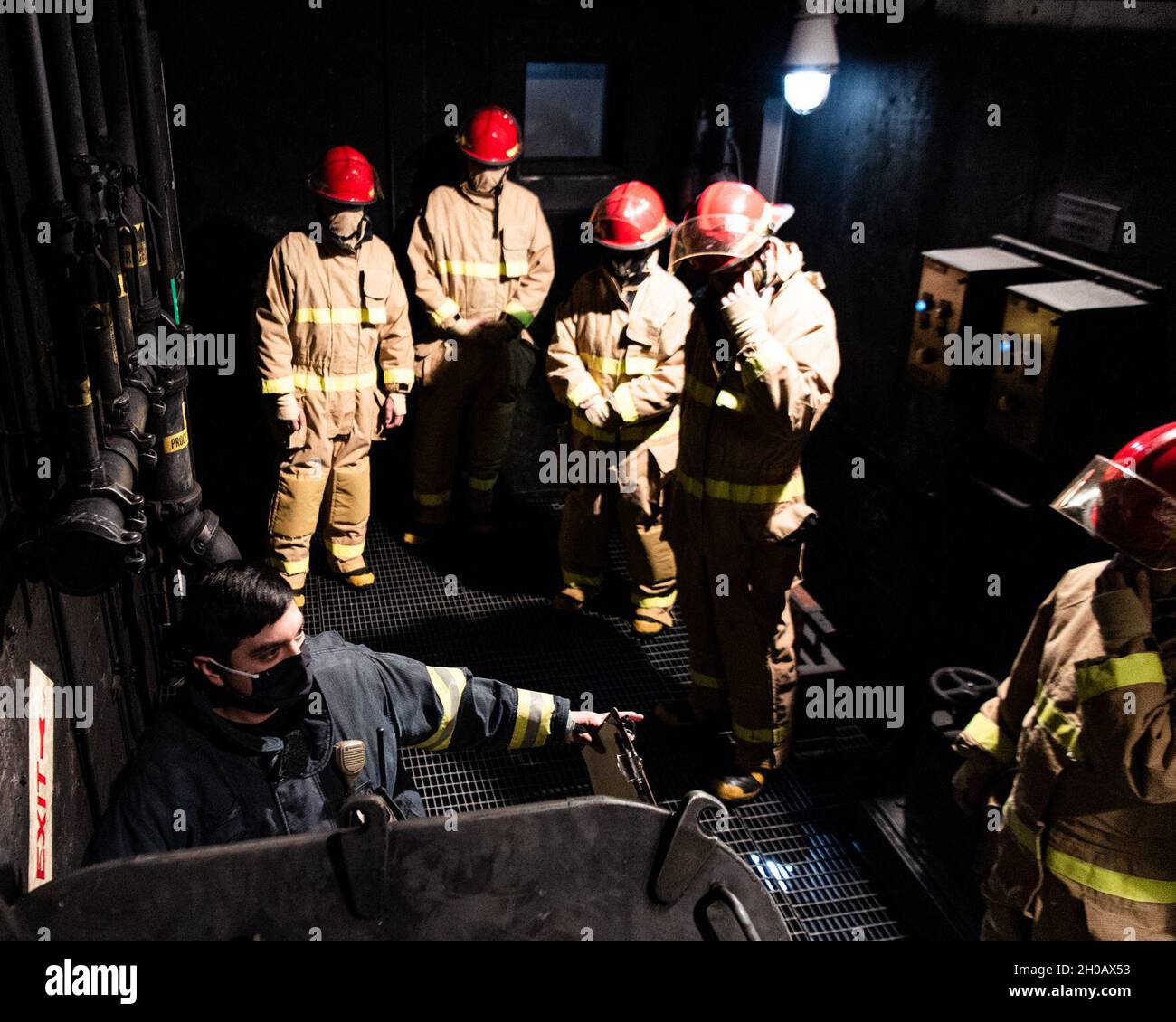 Damage Controlman 1st Class Conrado B. Rios, a technical trainer ...
