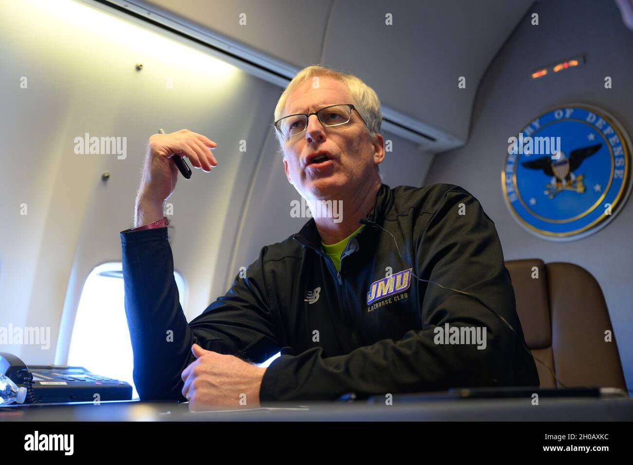 Acting Defense Secretary Chris Miller speaks to reporters on a government aircraft en route to Joint Base Andrews, Md., Jan. 14, 2021. Stock Photo