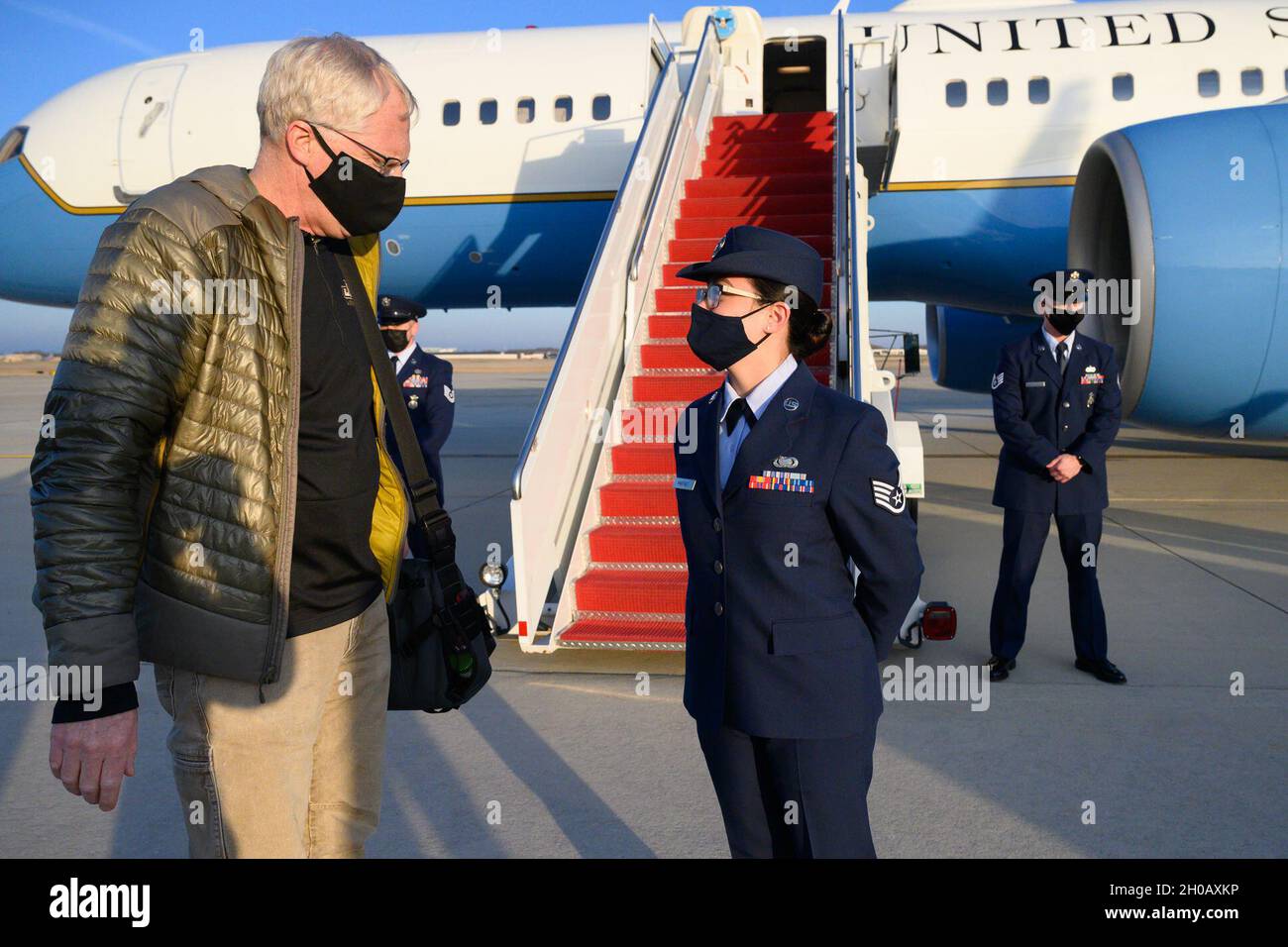 Acting Defense Secretary Chris Miller greets Joint Base Andrews Flight Line Protocol Officer Air Force Tech Sgt. Victoria Martinez upon arrival at Joint Base Andrews, Md., Jan. 14, 2021. Stock Photo
