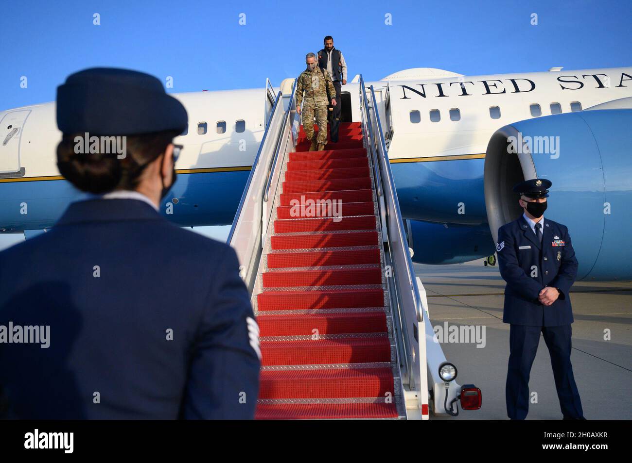 Senior Enlisted Advisor to the Chairman of the Joint Chiefs of Staff Ramón Colón-López and the chief of staff to Acting Defense Secretary Chris Miller, Kash Patel, arrive at Joint Base Andrews, Md., with Acting Defense Secretary Chris Miller, Jan. 14, 2021. Stock Photo