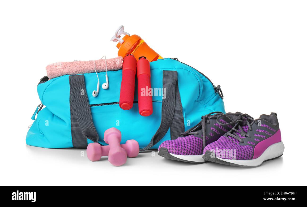 Sports bag and gym equipment on white background Stock Photo - Alamy