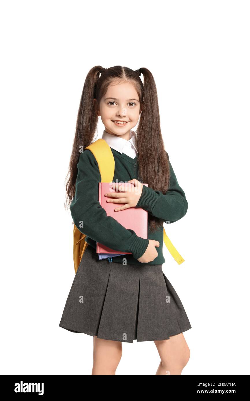 Little girl in stylish school uniform on white background Stock Photo ...