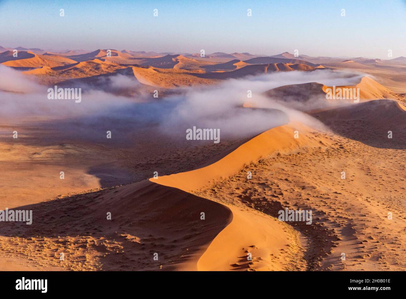 Sossusvlei dunes, with mist, Namib Erg listed as UNESCO World Heritage, Namib-Naukluft National Park, Namib Desert, Hardap region, Namibia Stock Photo